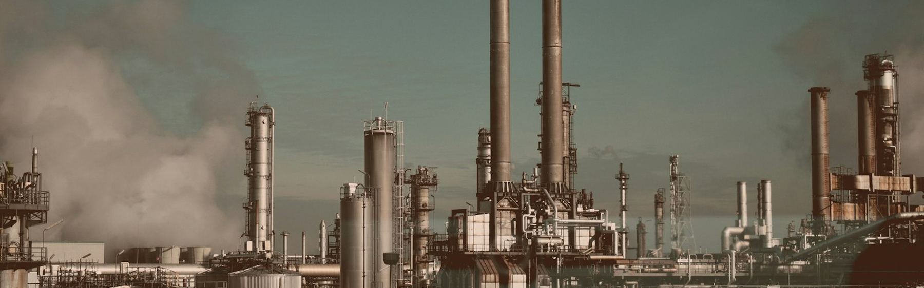 Industrial processing plant with storage tanks, towers and pipework
